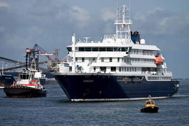 The Dutch Hantavirus-hit cruise ship MV Hondius sails off the Netherlands' coast as it approaches the port of Rotterdam on May 18, 2026. Cruise ship MV Hondius is expected to arrive at the port of Rotterdam and the ship's crew members will undergo a medical screening. (Photo by Nicolas TUCAT / AFP)