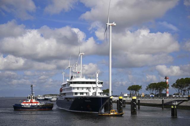 The Dutch Hantavirus-hit cruise ship MV Hondius arrives to dock at the port of Rotterdam on May 18, 2026. Cruise ship MV Hondius arrived at the port of Rotterdam and the ship's crew members will undergo a medical screening. (Photo by JOHN THYS / AFP)
