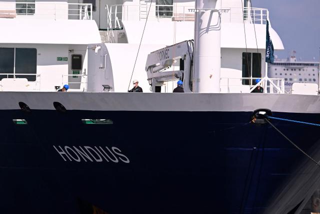The Dutch Hantavirus-hit cruise ship MV Hondius arrives to dock at the port of Rotterdam on May 18, 2026. Cruise ship MV Hondius arrived at the port of Rotterdam and the ship's crew members will undergo a medical screening. (Photo by JOHN THYS / AFP)