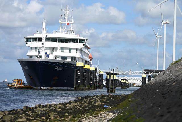 The Dutch Hantavirus-hit cruise ship MV Hondius docks at the port of Rotterdam on May 18, 2026. Cruise ship MV Hondius arrived at the port of Rotterdam and the ship's crew members will undergo a medical screening. (Photo by Nicolas TUCAT / AFP)