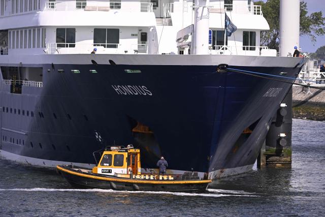 The Dutch Hantavirus-hit cruise ship MV Hondius dock at the port of Rotterdam on May 18, 2026. Cruise ship MV Hondius arrived at the port of Rotterdam and the ship's crew members will undergo a medical screening. (Photo by JOHN THYS / AFP)