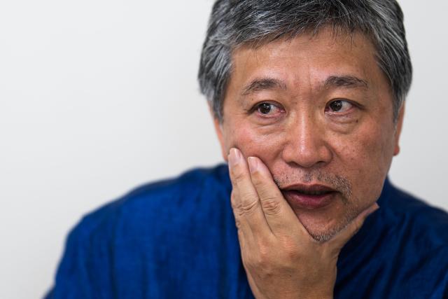 Japanese director and screenwriter Hirokazu Kore-eda speaks during an interview on the sidelines of the 79th edition of the Cannes Film Festival in Cannes, southern France, on May 17, 2026. Hirokazu Kore-eda, a leading figure in Japanese cinema and winner of the 2018 Palme d’Or, said on May 17, 2026 in Cannes – where his new film "Sheep in the Box" is in competition – that he would fight “to the very end” to ensure that a human being is involved “at every stage of film production”. (Photo by Julie SEBADELHA / AFP)