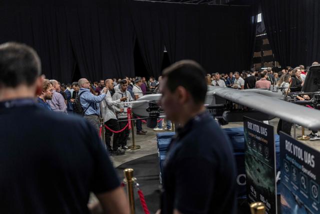 Visiters look at a drone on show at the Smart Mobility Summit 2026, in Tel Aviv on May 18, 2026. (Photo by ilia YEFIMOVICH / AFP)
