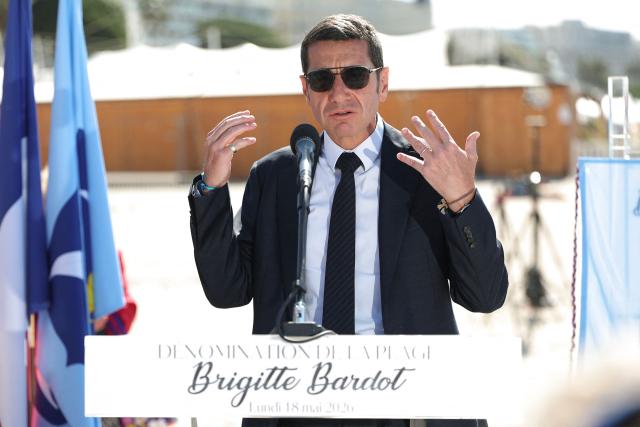 Mayor of Cannes David Lisnard delivers a speech during a ceremony to rename Plage Mace "Brigitte Bardot Beach" on the sidelines of the 79th edition of the Cannes Film Festival in Cannes, southern France, on May 18, 2026. (Photo by Sameer AL-DOUMY / AFP)