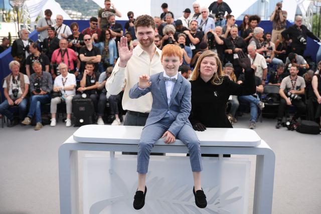 Lithuanian actor Kestutis Cicenas, Actor Bartas Zdanovicius and Ukrainian actress Anastasiia Pustovit pose during a photocall of the film "Vesna" at the 79th edition of the Cannes Film Festival in Cannes, southern France on May 18, 2026. (Photo by Valery HACHE / AFP)