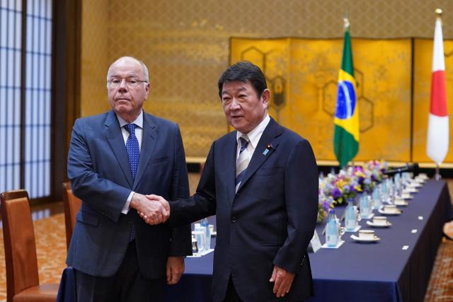 Brazil's Foreign Minister Mauro Vieira (L) is welcomed by his Japanese counterpart Toshimitsu Motegi before their meeting at the 1st Japan-Brazil Foreign Ministers' Strategic Dialogue in Tokyo on May 18, 2026. (Photo by Kazuhiro NOGI / AFP)