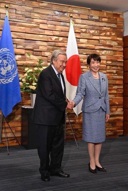 Japan's Prime Minister Sanae Takaichi (R) shakes hands with United Nations Secretary-General Antonio Guterres ahead of their meeting at the Prime Minister's Office in Tokyo on May 18, 2026. (Photo by David Mareuil / POOL / AFP)