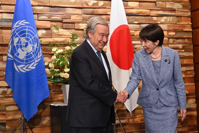 Japan's Prime Minister Sanae Takaichi (R) shakes hands with United Nations Secretary-General Antonio Guterres ahead of their meeting at the Prime Minister's Office in Tokyo on May 18, 2026. (Photo by David Mareuil / POOL / AFP)