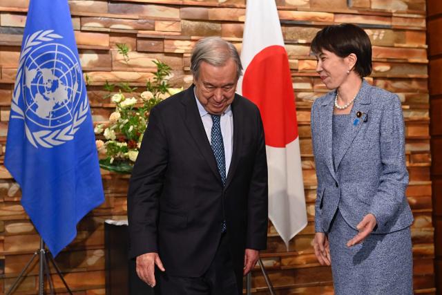 Japan's Prime Minister Sanae Takaichi (R) receives United Nations Secretary-General Antonio Guterres ahead of their meeting at the Prime Minister's Office in Tokyo on May 18, 2026. (Photo by David Mareuil / POOL / AFP)