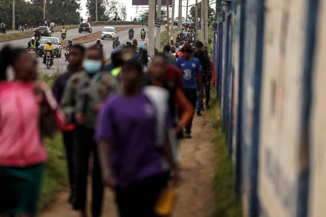 Kenyans walk to work during a nationwide transport strike over rising fuel prices in Nairobi on May 18, 2026. Public transport was largely shut down and protesters barricaded roads in Kenya on May 18, 2026 as a strike was called over a fuel price hike triggered by the Middle East war.
Kenya is one of many African countries dependent on fuel imports from the Gulf, and heavily hit by Iran's effective closure of the Strait of Hormuz through which a fifth of the world's oil normally passes. (Photo by SIMON MAINA / AFP)