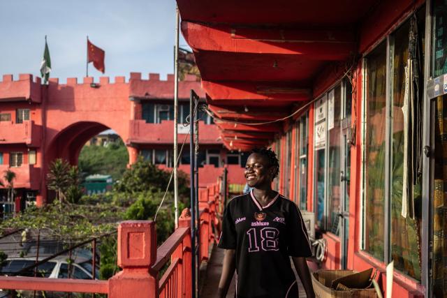 A worker walks inside China Town in the Ojota neighbourhood of Lagos on May 4, 2026. (Photo by OLYMPIA DE MAISMONT / AFP)