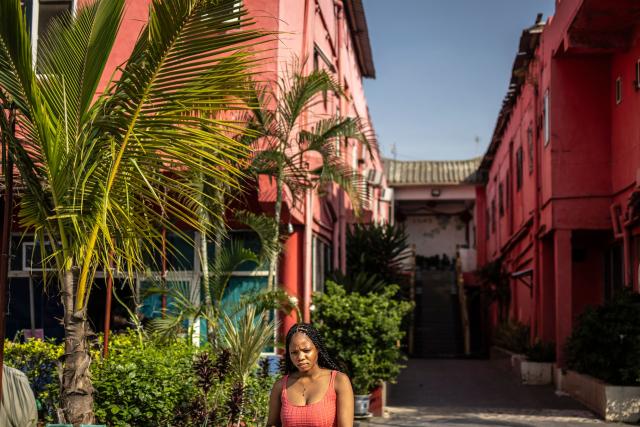 A visitor walks inside China Town in the Ojota neighbourhood of Lagos on May 5, 2026. (Photo by OLYMPIA DE MAISMONT / AFP)