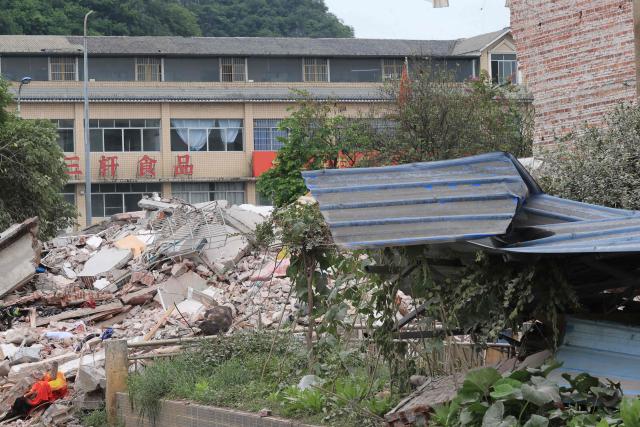 A collapsed building is seen after an earthquake at Liunan district district, in Liuzhou, China's southern Guangxi region on May 18, 2026. A 5.2-magnitude earthquake struck south China's Guangxi region on May 18, killing two people and causing 13 buildings to collapse, state media reported. (Photo by CN-STR / AFP) / China OUT