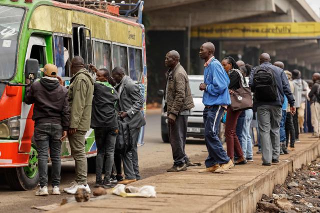 Kenyans wait for public transport during a nationwide transport strike over rising fuel prices in Nairobi on May 18, 2026. Public transport was largely shut down and protesters barricaded roads in Kenya on May 18, 2026 as a strike was called over a fuel price hike triggered by the Middle East war.
Kenya is one of many African countries dependent on fuel imports from the Gulf, and heavily hit by Iran's effective closure of the Strait of Hormuz through which a fifth of the world's oil normally passes. (Photo by SIMON MAINA / AFP)