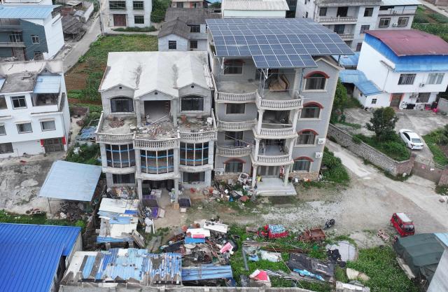 This photo shows a general view of damaged buildings after an earthquake at Liunan district, in Liuzhou, China's southern Guangxi region on May 18, 2026. A 5.2-magnitude earthquake struck south China's Guangxi region on May 18, killing two people and causing 13 buildings to collapse, state media reported. (Photo by CN-STR / AFP) / China OUT