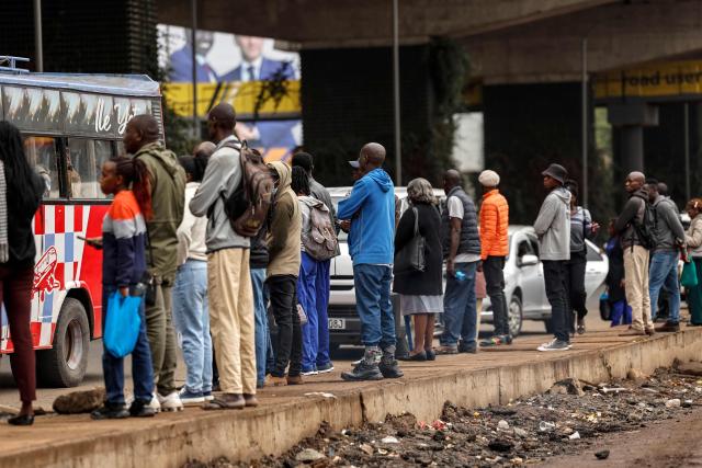 Kenyans wait for public tranpsort during a nationwide transport strike over rising fuel prices in Nairobi on May 18, 2026. Public transport was largely shut down and protesters barricaded roads in Kenya on May 18, 2026 as a strike was called over a fuel price hike triggered by the Middle East war.
Kenya is one of many African countries dependent on fuel imports from the Gulf, and heavily hit by Iran's effective closure of the Strait of Hormuz through which a fifth of the world's oil normally passes. (Photo by SIMON MAINA / AFP)