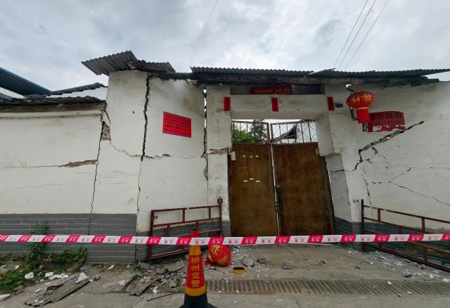 A damaged building is seen after an earthquake at Liunan district, in Liuzhou, China's southern Guangxi region on May 18, 2026. A 5.2-magnitude earthquake struck south China's Guangxi region on May 18, killing two people and causing 13 buildings to collapse, state media reported. (Photo by CN-STR / AFP) / China OUT
