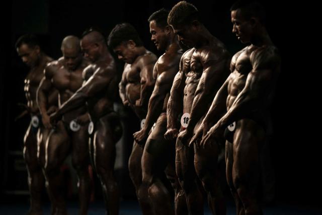 Bodybuilders compete in the 20th South East Asian Championships 2026 at the Myanmar Convention Centre in Yangon on May 17, 2026. (Photo by Sai Aung MAIN / AFP)