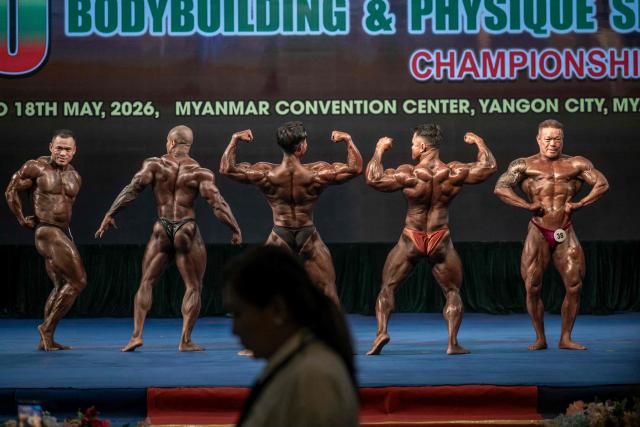 Bodybuilders compete in the 20th South East Asian Championships 2026 at the Myanmar Convention Centre in Yangon on May 17, 2026. (Photo by Sai Aung MAIN / AFP)