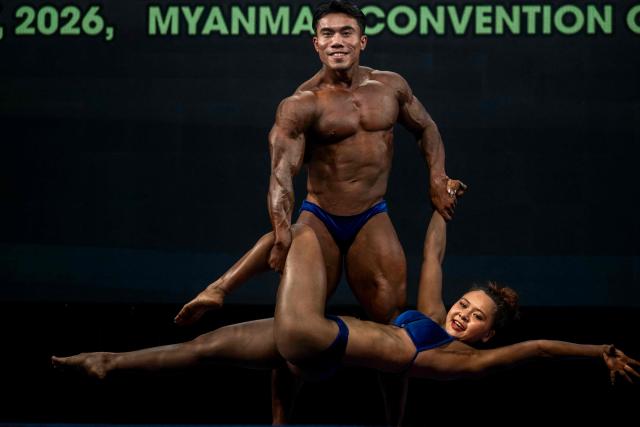 Bodybuilders compete in the 20th South East Asian Championships 2026 at the Myanmar Convention Centre in Yangon on May 17, 2026. (Photo by Sai Aung MAIN / AFP)