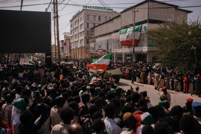 Somalilanders gather in the street during the 35th Independence day celebrations near the presidential palace in Hargeisa's Shap neighbourhood on May 18, 2026. (Photo by Kang-Chun Cheng / AFP)