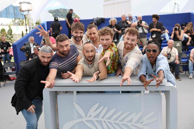 (From L) French voice actor Francois Sagat, French screenwriter Simon Balteaux, French director and screenwriter Nicolas Athane, French director and screenwriter Marco Nguyen, French screenwriter Brice Chevillard, French voice actor Jeremy Gillet, French actor Alex Ramires and French voice actor Shirley Souagnon pose during a photocall of the film "Jim Queen" at the 79th edition of the Cannes Film Festival in Cannes, southern France on May 18, 2026. (Photo by Thibaud MORITZ / AFP)