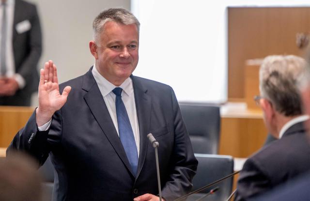 The new State Premier of Rhineland-Pfalz, Gordon Schnieder is sworn in by the President of the State Parliament Matthias Lammert on May 18, 2026 in Mainz, western Germany. The Constituent session of the new state parliament with the election of the Minister-President of Rhineland-Palatinate follows the state elections of March 22, 2026. (Photo by Torsten Silz / AFP)