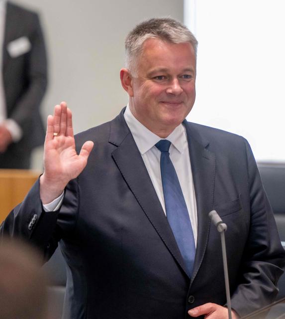 The new State Premier of Rhineland-Pfalz, member of the conservative Christian Democratic Union (CDU) party Gordon Schnieder sworns in in Mainz, western Germany, on May 18, 2026. The Constituent session of the new state parliament with the election of the Minister-President of Rhineland-Palatinate follows the state elections of March 22, 2026. (Photo by Torsten Silz / AFP)