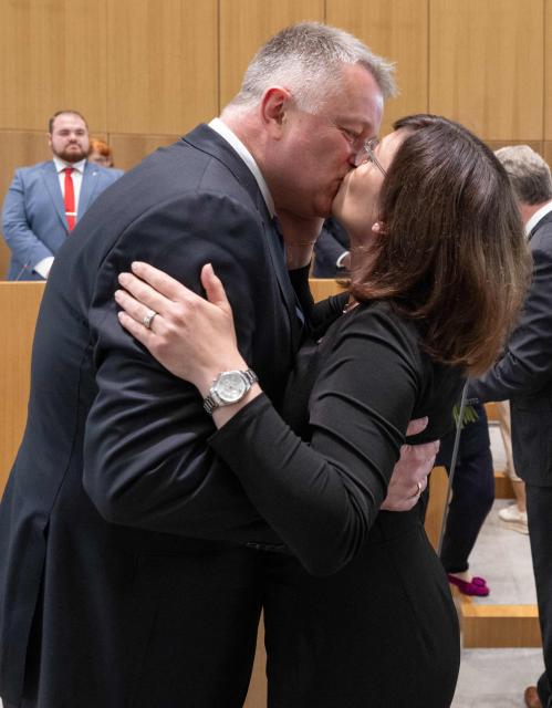 The new State Premier of Rhineland-Pfalz, member of the conservative Christian Democratic Union (CDU) party Gordon Schnieder kisses his wife Diane Schnieder after a sworn in ceremony on May 18, 2026 in Mainz, western Germany. The Constituent session of the new state parliament with the election of the Minister-President of Rhineland-Palatinate follows the state elections of March 22, 2026. (Photo by Boris Roessler / POOL / AFP)
