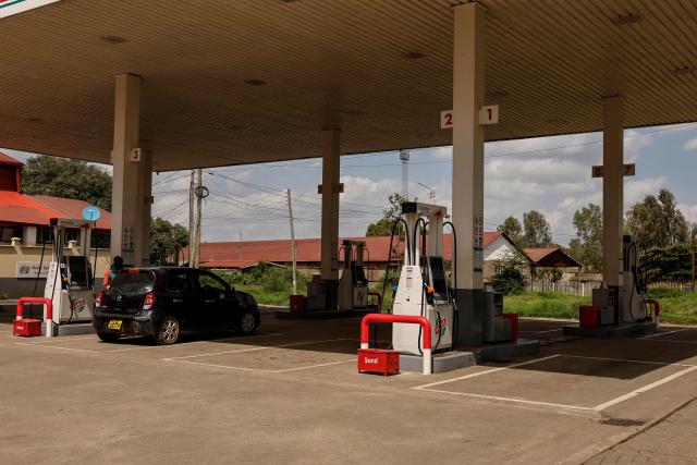 A general view of a motorist refuelling at a fuel station during a nationwide transport strike over rising fuel prices in Nairobi on May 18, 2026. Public transport was largely shut down and protesters barricaded roads in Kenya on May 18, 2026 as a strike was called over a fuel price hike triggered by the Middle East war.
Kenya is one of many African countries dependent on fuel imports from the Gulf, and heavily hit by Iran's effective closure of the Strait of Hormuz through which a fifth of the world's oil normally passes. (Photo by SIMON MAINA / AFP)