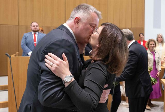 The new State Premier of Rhineland-Pfalz, member of the conservative Christian Democratic Union (CDU) party Gordon Schnieder kisses his wife Diane Schnieder after a sworn in ceremony on May 18, 2026 in Mainz, western Germany. The Constituent session of the new state parliament with the election of the Minister-President of Rhineland-Palatinate follows the state elections of March 22, 2026. (Photo by Boris Roessler / POOL / AFP)