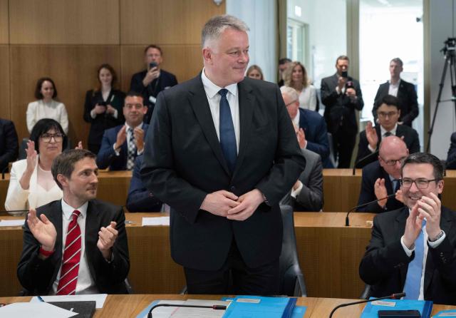 The new State Premier of Rhineland-Pfalz, member of the conservative Christian Democratic Union (CDU) party Gordon Schnieder is acknowledged by the members of the Rhineland-Palatinate state parliament during its constituent session in Mainz, western Germany, on May 18, 2026. The Constituent session of the new state parliament with the election of the Minister-President of Rhineland-Palatinate follows the state elections of March 22, 2026. (Photo by Boris Roessler / POOL / AFP)