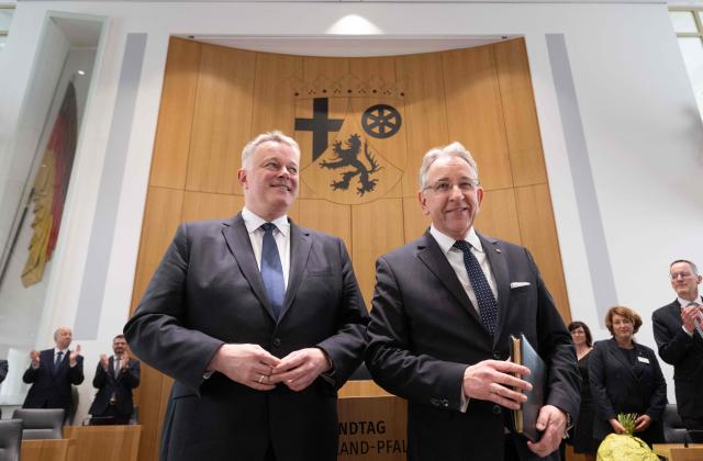 The new State Premier of Rhineland-Palatinate, member of the conservative Christian Democratic Union (CDU) party Gordon Schnieder (L) and the President of the State Parliament Matthias Lammert, pose for medias after a sworn in ceremony on May 18, 2026 in Mainz, western Germany. The Constituent session of the new state parliament with the election of the Minister-President of Rhineland-Palatinate follows the state elections of March 22, 2026. (Photo by Boris Roessler / POOL / AFP)
