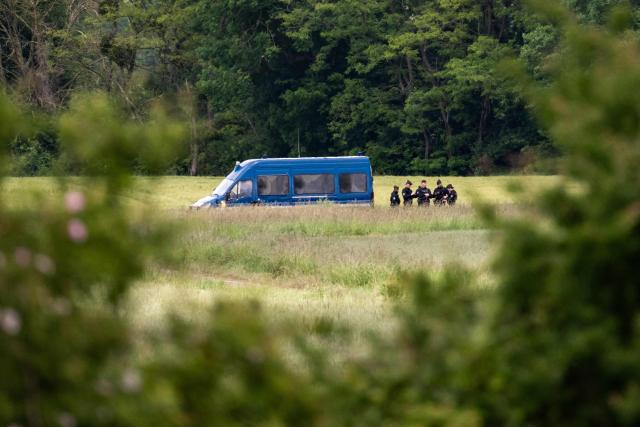 French gendarmes stand guard in a security perimeter as new excavations start for victims of alleged serial killer Emile Louis, in Rouvray, central-eastern France on May 18, 2026. These new excavations are the third in less than two years, following digs carried out in the fall of 2024 and then in May 2025. (Photo by ARNAUD FINISTRE / AFP)