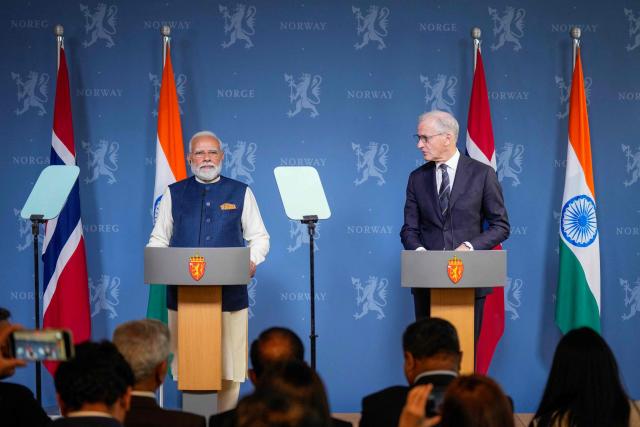 India's Prime Minister Narendra Modi (L) and Norway's Prime Minister Jonas Gahr Store (R) hold a joint press conference after their meeting at the government's representative facility in Olso, Norway, on May 18, 2026. India's Prime Minister Narendra Modi is on five-nation tour and will attend the third Nordic-Indian Summit on May 18 and 19, 2026. (Photo by Fredrik Varfjell / NTB / AFP) / Norway OUT