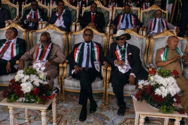 Former Vice President of Somaliland, Abdirahman Abdillahi Ismail “Saylici”, former Vice President, Ahmed Yusuf Yasin, Chairman of the Supreme Court of Somaliland, Adan Haji Ali Ahmed; former Vice President of Somaliland, Abdirahman Aw Ali Farah, and former President of Somaliland, Muse Bihi Abdi, attend the 35th Independence day celebrations near the presidential palace in Hargeisa's Shap neighbourhood on May 18, 2026. (Photo by Kang-Chun Cheng / AFP)