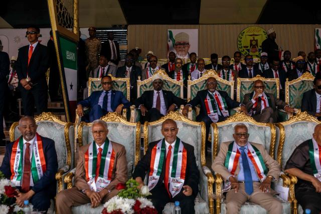 Chairman of the Waddani Party Xirsi Hersi Ali Hassan, Chairman of the KAAH Party Mohamoud Hashi Abdi, and Chairman of the House of Representatives of Somaliland Yasin Haji Mohamoud Hiir “Faratoon”, attend the 35th Independence day celebrations near the presidential palace in Hargeisa's Shap neighbourhood on May 18, 2026. (Photo by Kang-Chun Cheng / AFP)