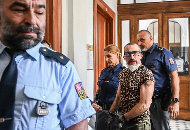 Marla-Svenja Liebich (2nd R), a convicted German far-right extremist and neo-Nazi formerly known as Sven is escorted by Czech prison service to the Regional court on May 18, 2026 in Pilsen, Czech Republic, where Leibich will wait for court decision to decide on extradition to Germany. (Photo by Michal Cizek / AFP)