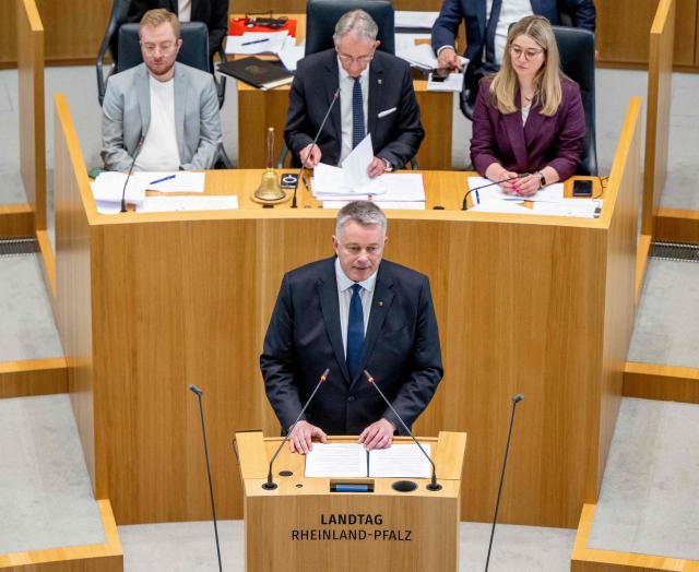The new State Premier of Rhineland-Palatinate, member of the conservative Christian Democratic Union (CDU) party, Gordon Schnieder (C, bottom), delivers his first speech at the State Parliament on May 18, 2026 in Mainz, western Germany. The Constituent session of the new state parliament with the election of the Minister-President of Rhineland-Palatinate follows the state elections of March 22, 2026. (Photo by Torsten Silz / AFP)