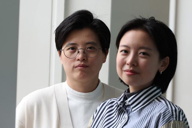 Taiwanese writer Yang Shuang-zi (L) poses with her translator Lin King (R) during an appearance at SOAS in central London on May 18, 2026, on the eve of the 2026 International Booker Prize announcement. Yang Shuang-zi's "Taiwan Travelogue" is one of the six International Booker Prize entries for 2026 (Photo by Adrian Dennis / AFP)