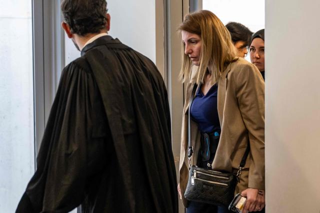 Defendant Laetitia R. arrives for the trial of Guillaume B., who is accused of multiple acts of abuse against his partner over seven years from 2015 to 2020, at the Alpes-de-Haute-Provence court in Digne-les-Bains, southeastern France, on May 18, 2026. (Photo by MIGUEL MEDINA / AFP)