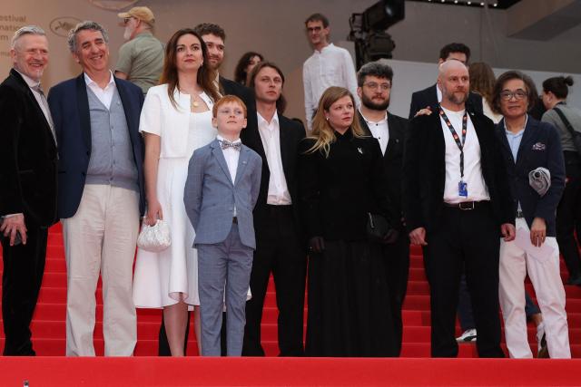 (From 3L) Franco-Chilean producer Helena Pokorny, Lithuanian actor Kestutis Cicenas, Lithuanian actor Bartas Zdanovicius, Lithuanian director and screenwriter Rostislav Kirpicenko, Ukrainian actress Anastasiia Pustovit, Ukrainian producer Alexey Zgonik, Ukrainian producer Vitalii Sheremetiev arrives for the screening of the film "Vesna" at the 79th edition of the Cannes Film Festival in Cannes, southern France on May 18, 2026. (Photo by Valery HACHE / AFP)