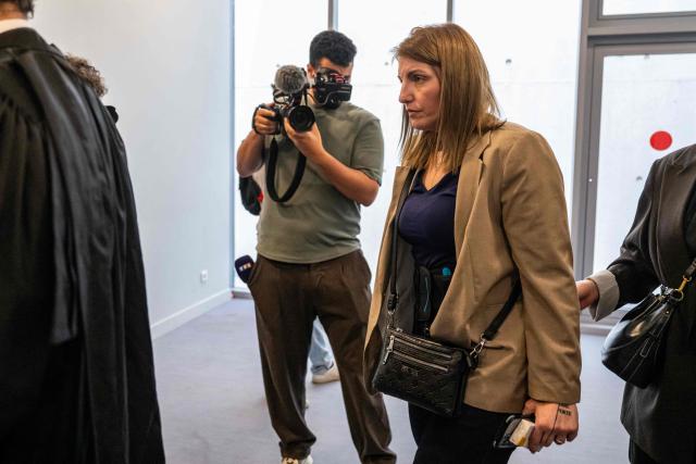 Defendant Laetitia R. arrives for the trial of Guillaume B., who is accused of multiple acts of abuse against his partner over seven years from 2015 to 2020, at the Alpes-de-Haute-Provence court in Digne-les-Bains, southeastern France, on May 18, 2026. (Photo by MIGUEL MEDINA / AFP)