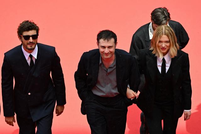 (From L) French-Canadian actor Niels Schneider, French director and screenwriter Arthur Harari, French actress Lea Seydoux arrive for the screening of the film "L'Inconnue" (The Unknown) at the 79th edition of the Cannes Film Festival in Cannes, southern France on May 18, 2026. (Photo by Antonin THUILLIER / AFP)