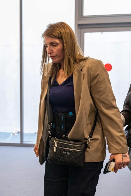 Defendant Laetitia R. arrives for the trial of Guillaume B., who is accused of multiple acts of abuse against his partner over seven years from 2015 to 2020, at the Alpes-de-Haute-Provence court in Digne-les-Bains, southeastern France, on May 18, 2026. The trial of Guillaume B., accused of subjecting his partner to seven years of abuse and rape accompanied by acts of torture, began on May 18, 2026 at the Assize Court in Digne-les-Bains (Alpes-de-Haute-Provence), where he faces a life sentence. (Photo by MIGUEL MEDINA / AFP)