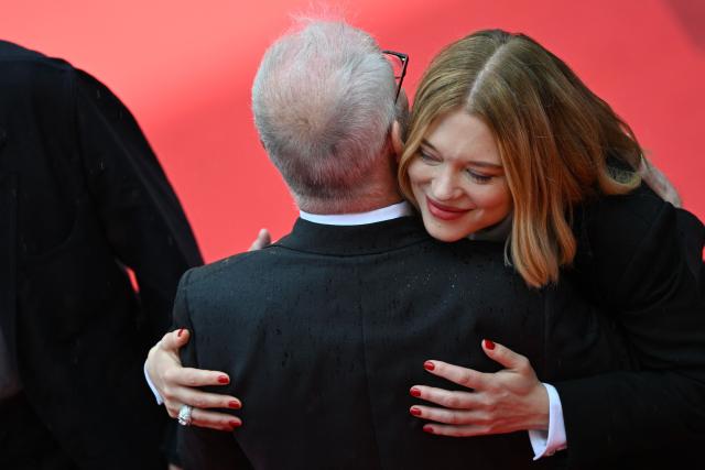 Cannes film festival director Thierry Fremaux hugs French actress Lea Seydoux arrive for the screening of the film "L'Inconnue" (The Unknown) at the 79th edition of the Cannes Film Festival in Cannes, southern France on May 18, 2026. (Photo by Antonin THUILLIER / AFP)