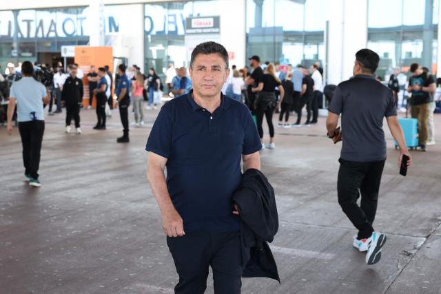Iran's head coach Amir Ghalenoei arrives exits a terminal following the arrival of Iran's national football team in Turkey ahead of their trip to the United States for the FIFA World Cup 2026, at Antalya airport in Antalya, southern Turkey, on May 18, 2026. Iran's football team arrived in Turkey on Monday for a training camp and to complete visa applications ahead of the 2026 World Cup, AFP correspondents said. (Photo by Oner SAN / AFP)