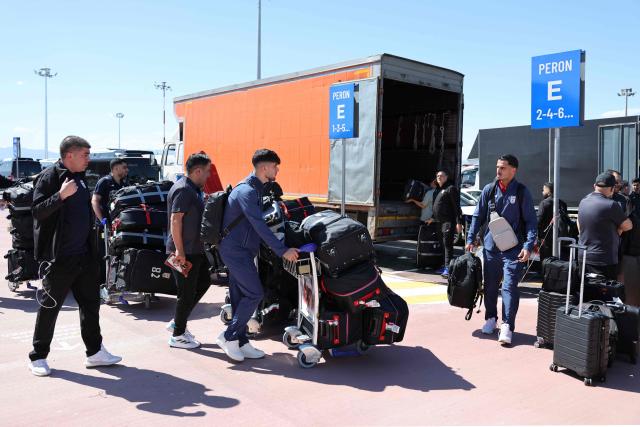 Members of the Iranian national football team walk with luggage following their arrival in Turkey ahead of their trip to the United States for the FIFA World Cup 2026, at Antalya airport in Antalya, southern Turkey, on May 18, 2026. Iran's football team arrived in Turkey on Monday for a training camp and to complete visa applications ahead of the 2026 World Cup, AFP correspondents said. (Photo by Oner SAN / AFP)