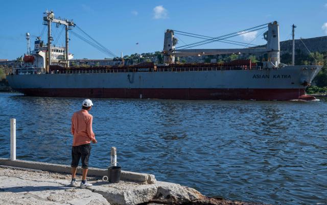The Asian Katra, a Panama-flagged cargo ship, arrives in Havana Bay carrying humanitarian aid, in Havana, on May 18, 2026. A new shipment of humanitarian aid from Mexico arrived in Cuba on May 18, as the island grapples with a severe economic and energy crisis nearly four months after the imposition of an oil blockade by Washington. (Photo by YAMIL LAGE / AFP)