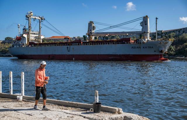 The Asian Katra, a Panama-flagged cargo ship, arrives in Havana Bay carrying humanitarian aid, in Havana, on May 18, 2026. A new shipment of humanitarian aid from Mexico arrived in Cuba on May 18, as the island grapples with a severe economic and energy crisis nearly four months after the imposition of an oil blockade by Washington. (Photo by YAMIL LAGE / AFP)